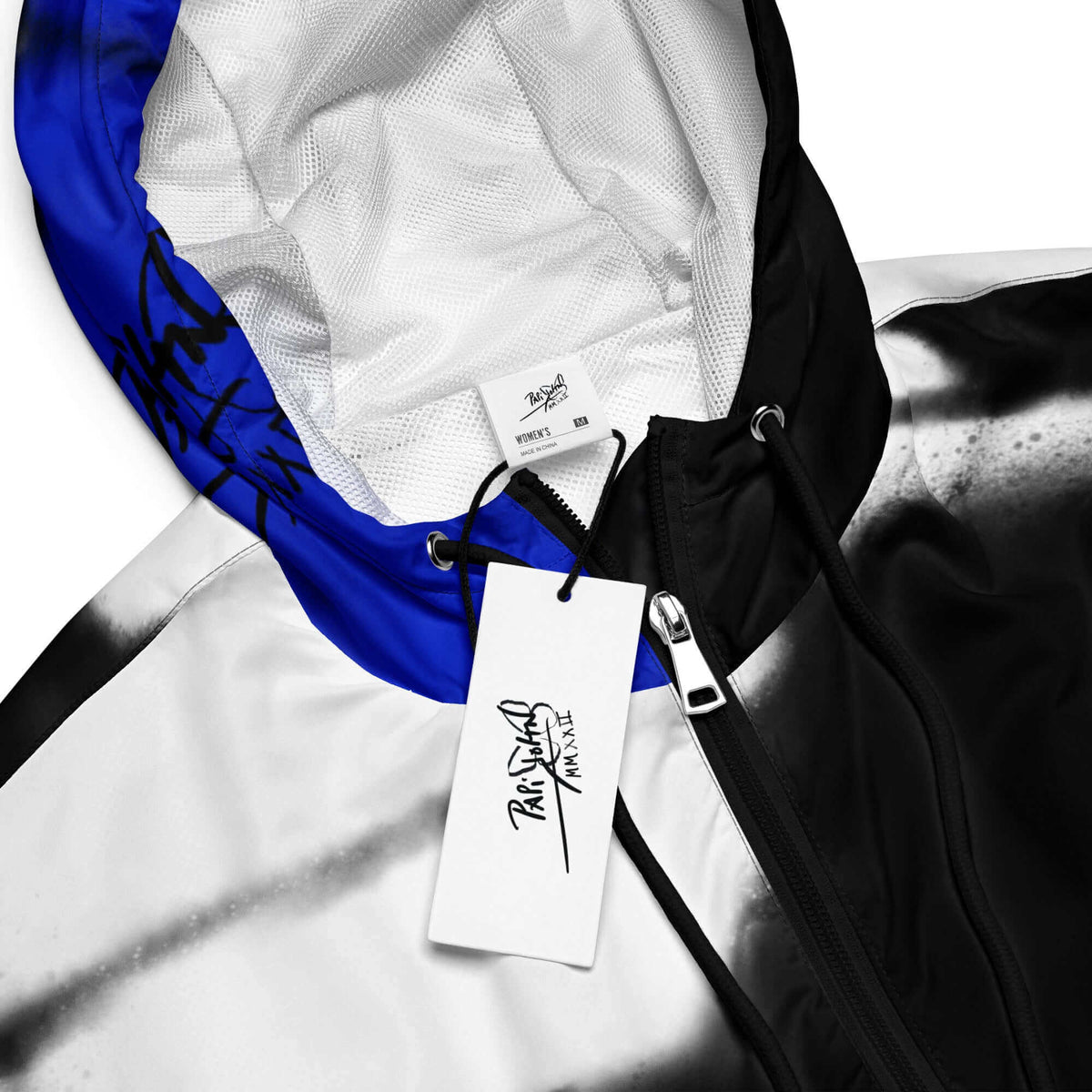 Close-up detail view highlighting the vibrant electric blue colorway, ultra-dynamic technical fabric, and custom PapiJohn® brand hardware on the SALA 3 | Crop Attitude Blue Windbreaker by $arah Free 💎. Honest luxury streetwear curated in Cadifornia.