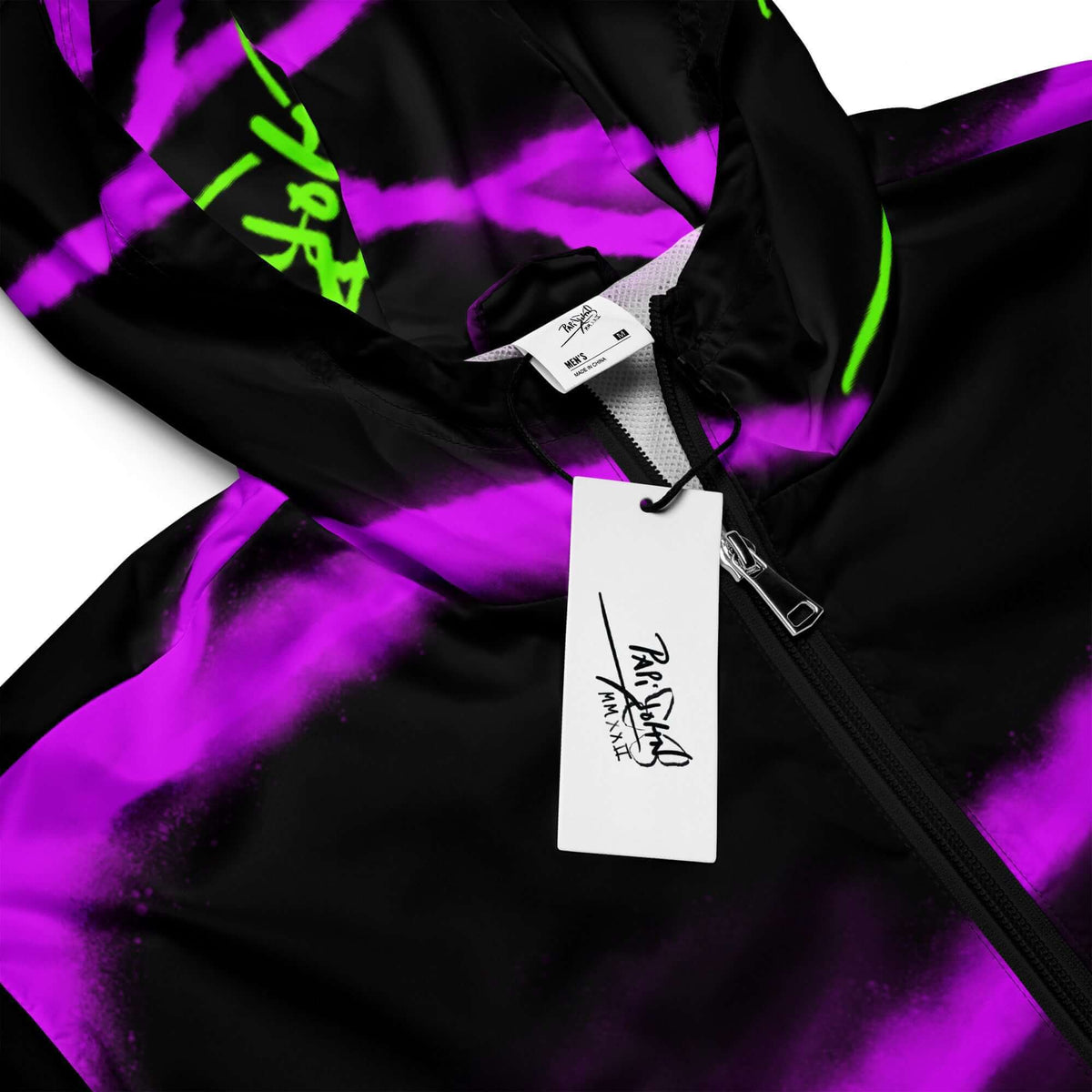 Close-up detail view highlighting the inverse faded purple wing texture, electric neon signature details, and lightweight technical fabric on the SALA 3 | Purple Wing Neon Canvas Studio Jacket by $arah Free 💎. Honest luxury studio gear curated in Cadifornia.