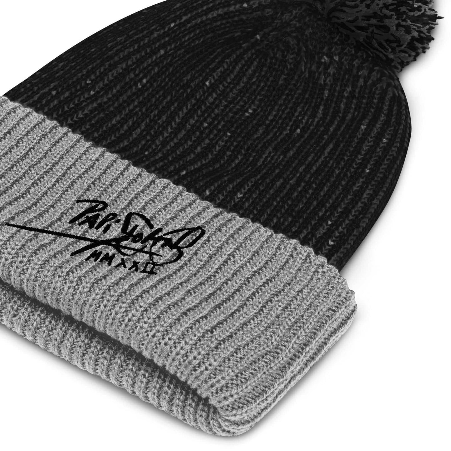 PapiJohn® Macro technical close-up focusing on the high-density absolute black thread calligraphic signature script embroidered over the premium ribbed knit fabric fold by $arah Free 💎 | High-Tier Archive