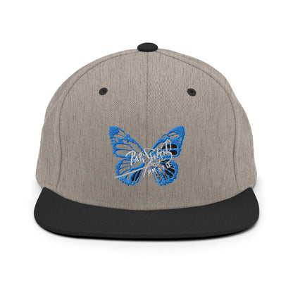 PapiJohn® The Blue Butterfly Snapback Archive in black heather textured weave front view tracing the blue butterfly stitch work over the curated grain matrix | Sala 1 Wearable Art Fashion