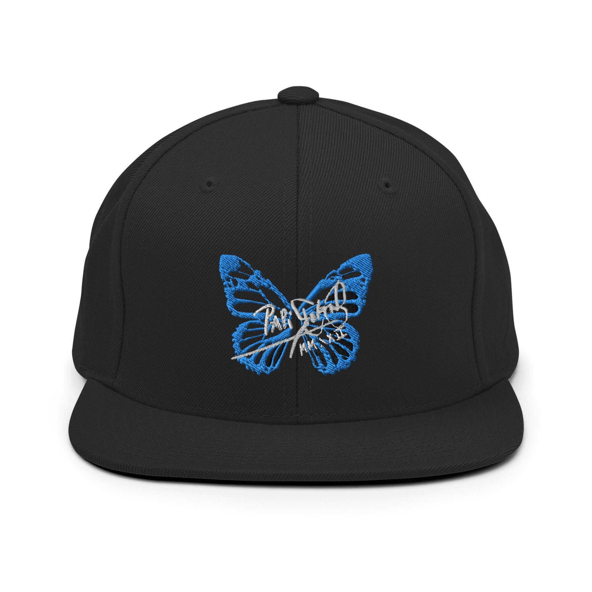PapiJohn® The Blue Butterfly Snapback Archive in solid black front view showcasing the iconic blue butterfly silhouette embroidered in sharp volumetric precision stitch | Sala 1 Wearable Art Fashion