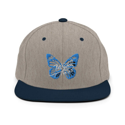 PapiJohn® The Blue Butterfly Snapback Archive in grey and navy dual-panel layout presenting the blue butterfly embroidery with maximum visual neatness | Sala 1 Wearable Art Fashion