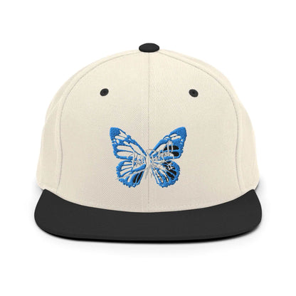 PapiJohn® The Blue Butterfly Snapback Archive in raw natural and black panels front view rendering the ultimate organic contrast for the blue butterfly thread | Sala 1 Wearable Art Fashion