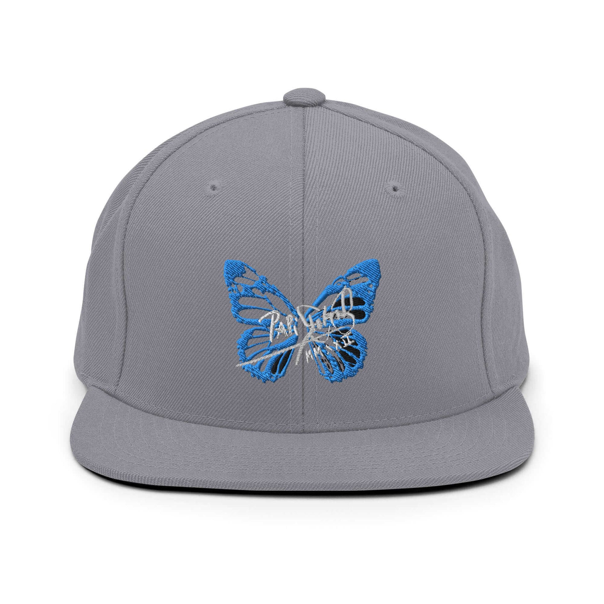 PapiJohn® The Blue Butterfly Snapback Archive in metallic silver front view focusing on the clean high-fidelity reflection of the blue embroidered butterfly icon | Sala 1 Wearable Art Fashion