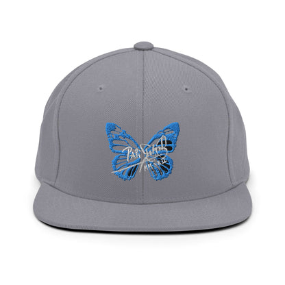 PapiJohn® The Blue Butterfly Snapback Archive in metallic silver front view focusing on the clean high-fidelity reflection of the blue embroidered butterfly icon | Sala 1 Wearable Art Fashion