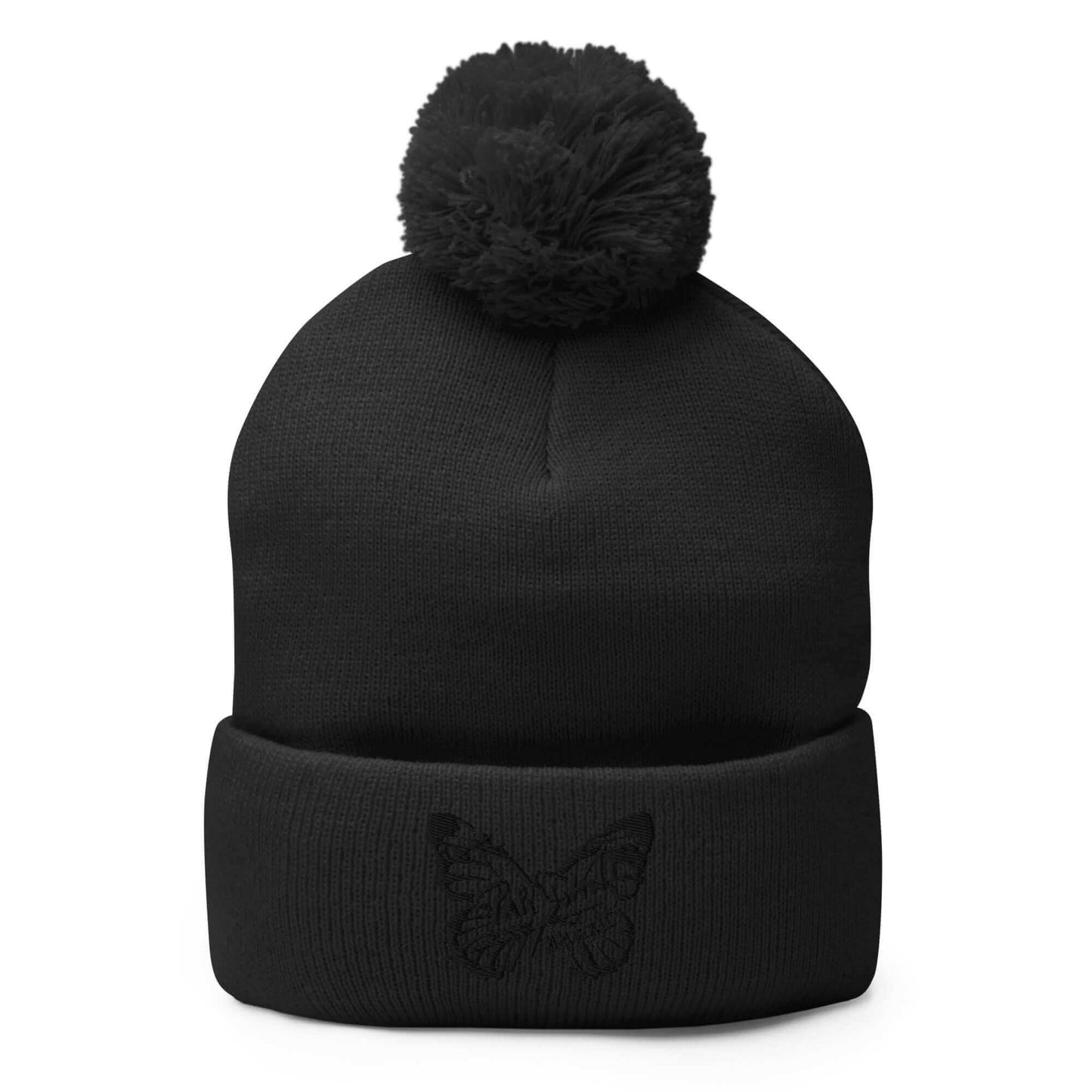 PapiJohn® The Butterfly Signature Pom-Pom Beanie in solid black front view displaying the premium black thread butterfly design embroidered in high density by $arah Free 💎 | Sala 1 Wearable Art Fashion