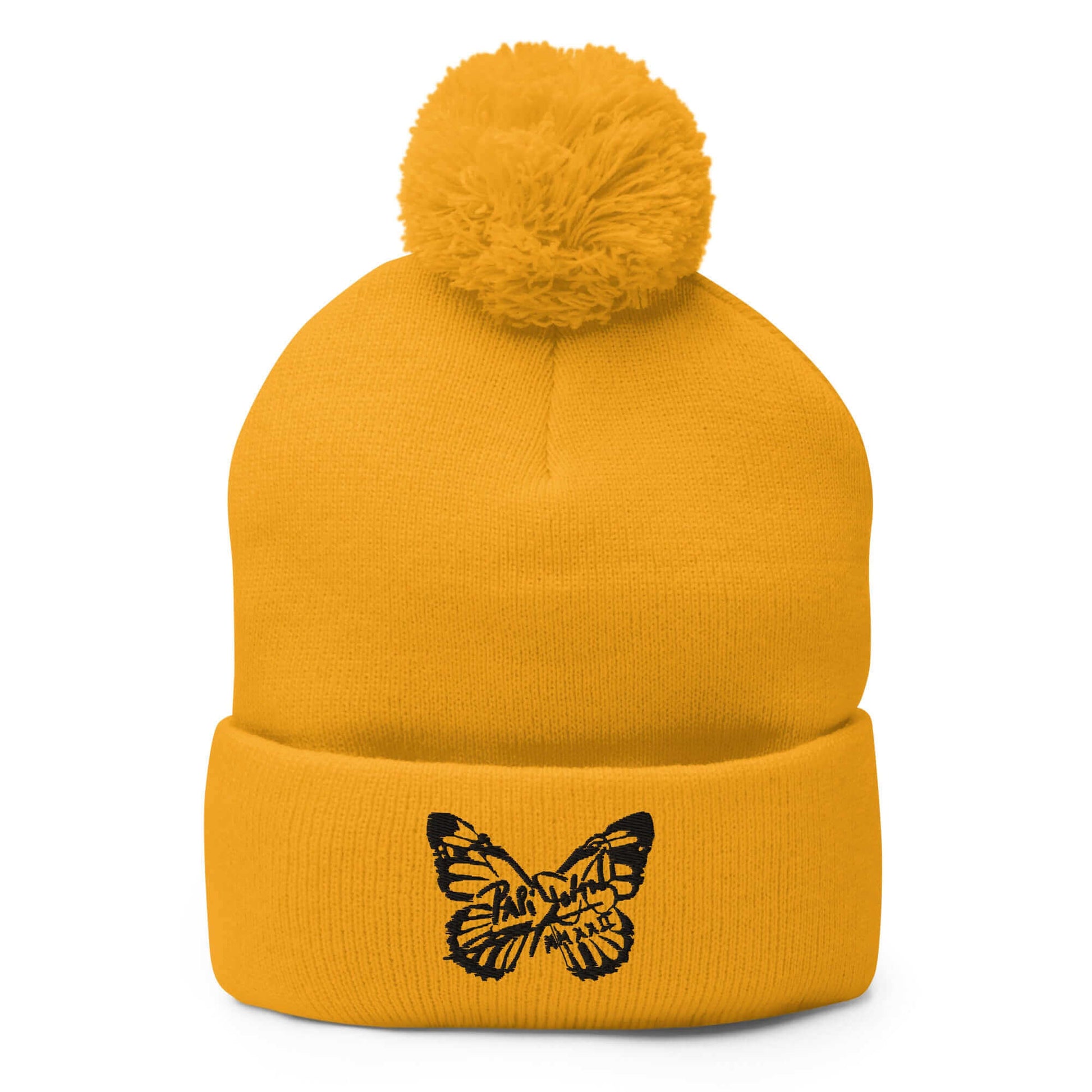 PapiJohn® The Butterfly Signature Pom-Pom Beanie in rich heraldic gold knit tone front view presenting the immaculate heavy stitch black butterfly motif | High-End Subcultural Archive