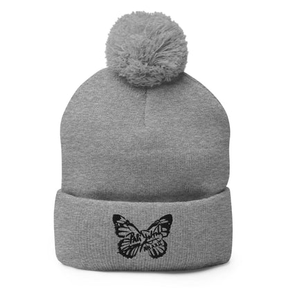 PapiJohn® The Butterfly Signature Pom-Pom Beanie in classic heather grey canvas front view showing the structured contrast of the black butterfly stitch logo | Streetwear d'Auteur