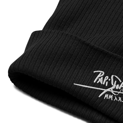 PapiJohn® The Eco-Signature Beanie premium eco-friendly headwear close-up micro detail highlighting the high-density embroidery precision and sustainable black rib knit texture by $arah Free 💎 | Streetwear d'Auteur