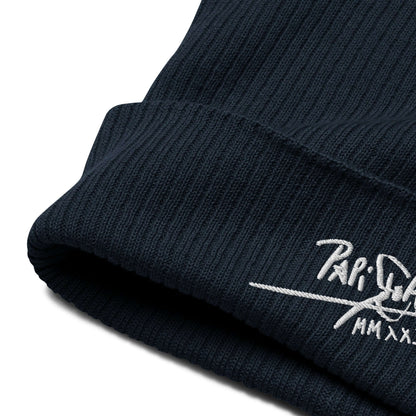 PapiJohn® The Eco-Signature Beanie premium eco-friendly headwear close-up macro detail highlighting the deep navy blue textile ribbing tension and refined embroidery stitch work by $arah Free 💎 | Artist-Driven Streetwear