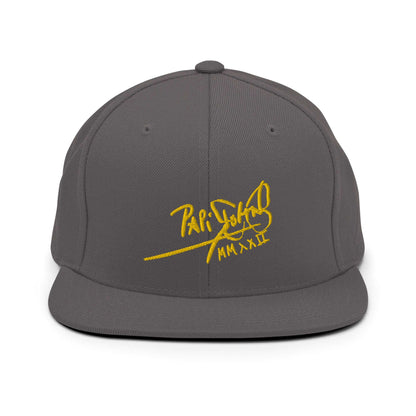 PapiJohn® The Gold Signature Classic Snapback in dark grey front layout rendering the deep texture under the heavy gold 3D stitch script | Sala 1 Wearable Art Fashion