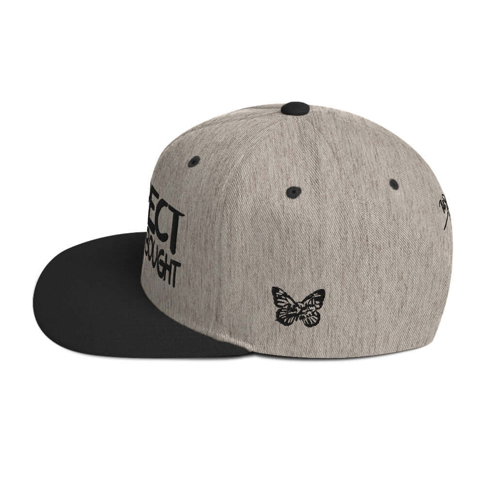PapiJohn® The Respect Archive Black Signature Edition Snapback in black heather left profile highlighting the rigid crown build and flat visor line | Streetwear d'Auteur