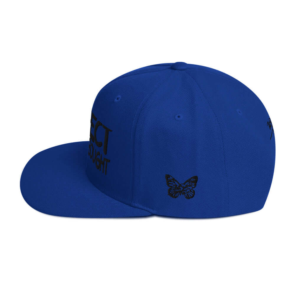 PapiJohn® The Respect Archive Black Signature Edition Snapback in royal blue left side profile showing the rigid high crown height and straight visor architecture | Streetwear d'Auteur