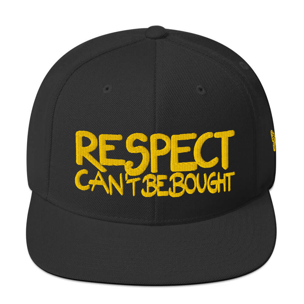 Front view of the SALA 1 | The "Respect" Archive Gold Edition snapback cap by PapiJohn®. Featuring gold thread embroidery on the crown in tribute to The Anonymous Genius by $arah Free 💎. High-end streetwear and luxury streetwear de autor ideado en Cadifornia.