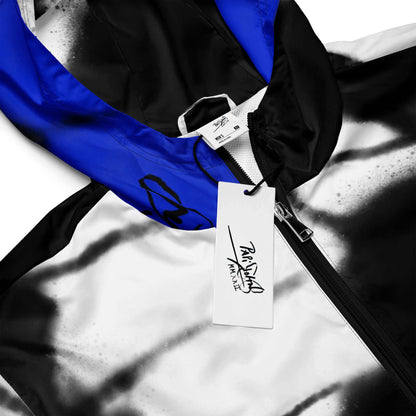 Close-up detail view highlighting the high-density electric blue 3D wing print, weather-resistant technical fabric, and custom PapiJohn® brand hardware on the SALA 3 | Attitude Blue Monarca Windbreaker by $arah Free 💎. Honest luxury outerwear curated in Cadifornia.