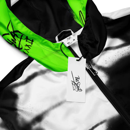 Close-up detail view highlighting the high-voltage fluor green wing print, weather-resistant technical fabric, and custom PapiJohn® brand hardware on the SALA 3 | Attitude Neon Monarca Windbreaker by $arah Free 💎. Honest luxury studio gear curated in Cadifornia.