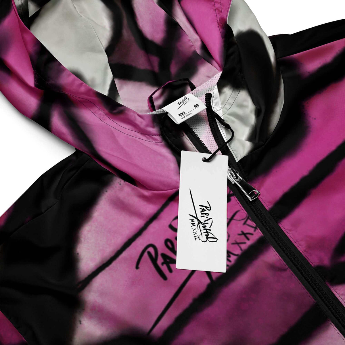 Close-up detail view highlighting the dense black spray paint gradients, organic macro wing grain, and custom PapiJohn® brand tagging on the SALA 3 | New Alas Graff Windbreaker by $arah Free 💎. Honest luxury streetwear craftsmanship curated in Cadifornia.