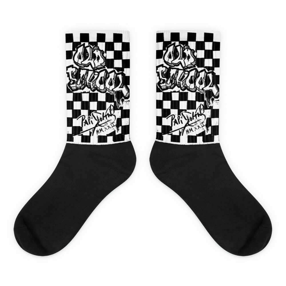 PapiJohn® 🏛️ Sala 4 | Old School Grid | Studio Essentials — Front view of the Black and White sublimated socks featuring a practical black sole. Showcasing a hand-painted 80s checkerboard grid and pure graffiti trace tribute by $arah Free 💎. Honest luxury accessories, daily movement essentials, and the perfect Artist's Uniform foundation curated in Cadifornia.