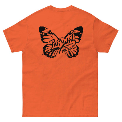 PapiJohn® 🏛️ Sala 5 | The Butterfly Universe | Identity Canvas — Back view showing the full-size solid black signature butterfly artwork across the shoulders of the Orange Canvas Tee by $arah Free 💎. Gallery archive piece, honest luxury apparel, and wearable art curated in Cadifornia.