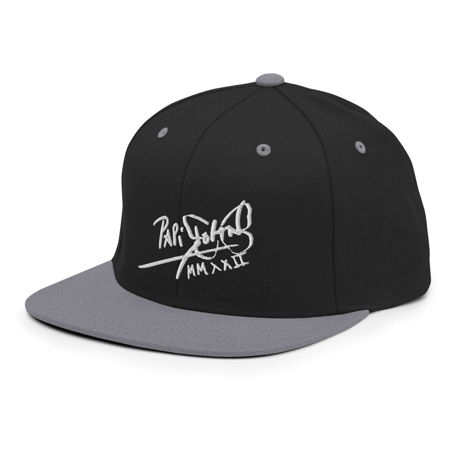 PapiJohn® The Signature High-Crown Snapback premium headwear left side profile highlighting the color-blocked contrast between the black crown and silver brim by $arah Free 💎 | Artist-Led Streetwear