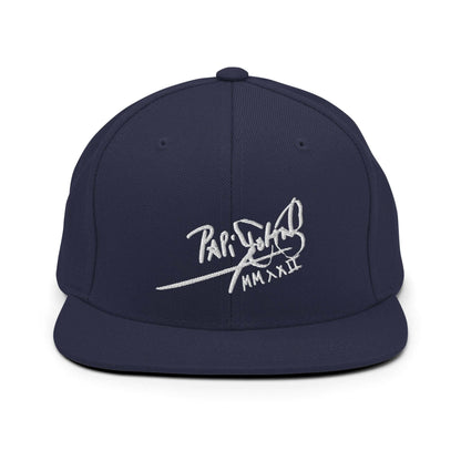 PapiJohn® The Signature High-Crown Snapback premium headwear front view showcasing the white embroidered original signature on a deep navy blue wool blend panels layout by $arah Free 💎 | Artist-Led Streetwear