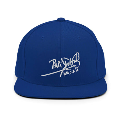 PapiJohn® The Signature High-Crown Snapback premium headwear front view showcasing the sharp white embroidered original signature on a vibrant royal blue wool blend structure by $arah Free 💎 | Artist-Driven Streetwear