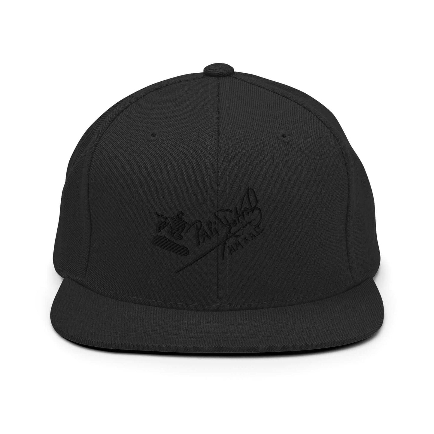 PapiJohn® The Skate Archive Signature Snapback in solid black front layout showcasing the dark-on-dark contrast of the volumetric black thread skate illustration | Sala 1 Wearable Art Fashion