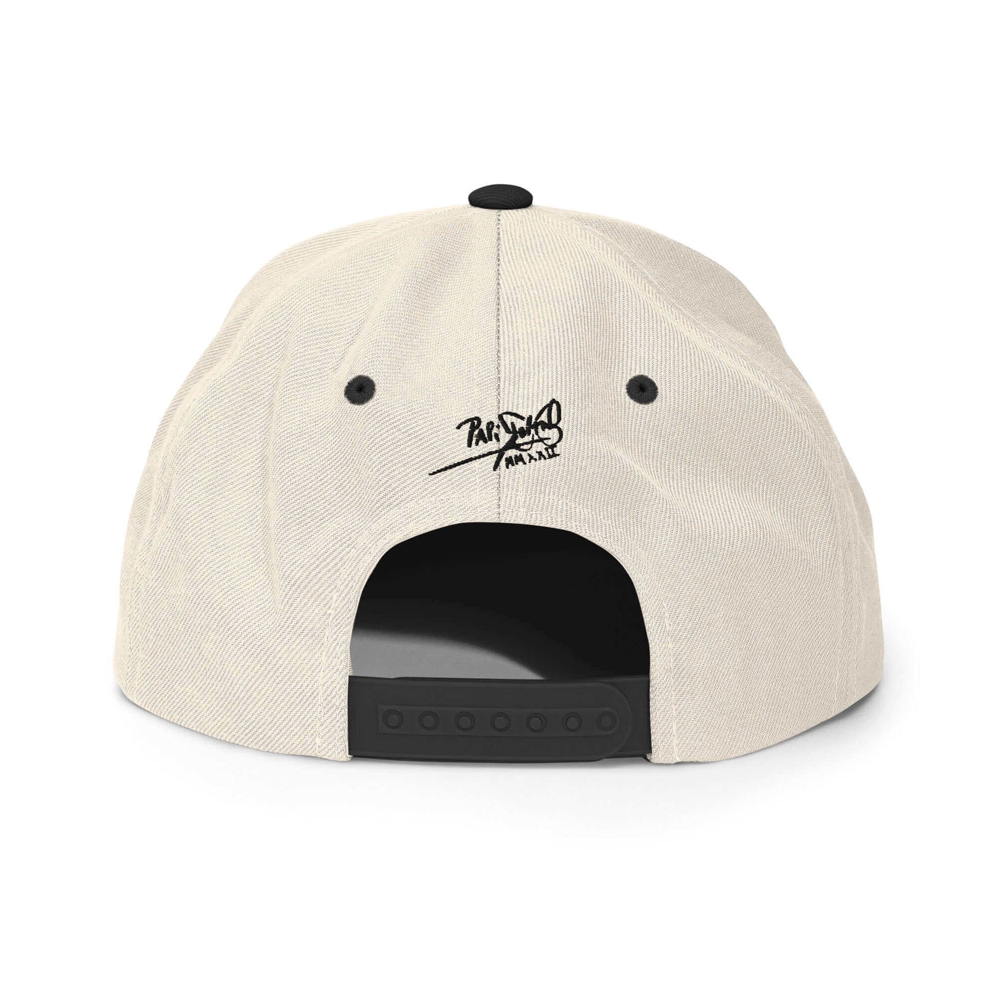 PapiJohn® The Skate Archive Signature Snapback in raw natural and black panels back view highlighting the perfect structural geometry and custom snap strap finish | Artist-Led Streetwear