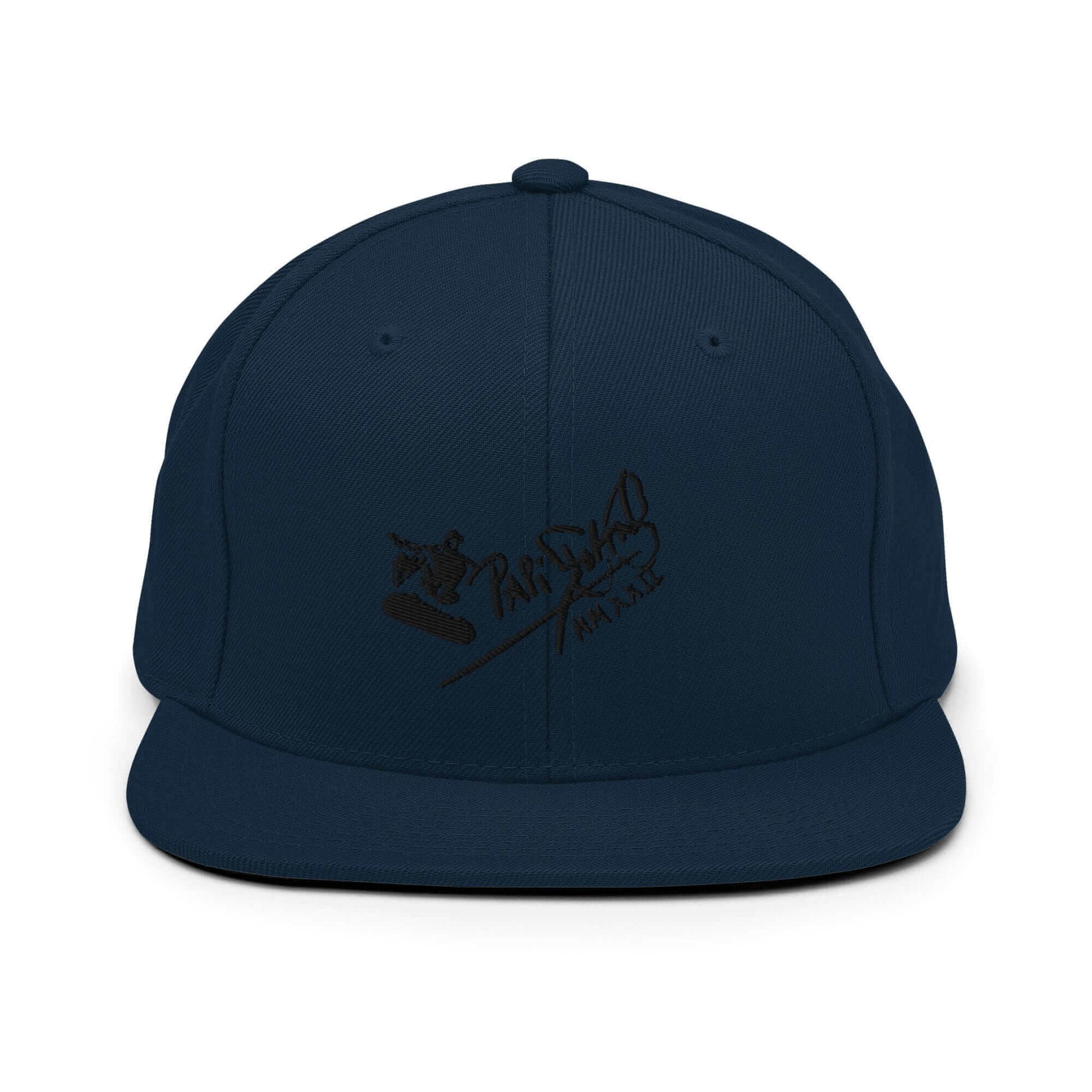PapiJohn® The Skate Archive Signature Snapback in dark navy front view highlighting the black embroidered skater jumping over the rail vector graphic | Sala 1 Wearable Art Fashion