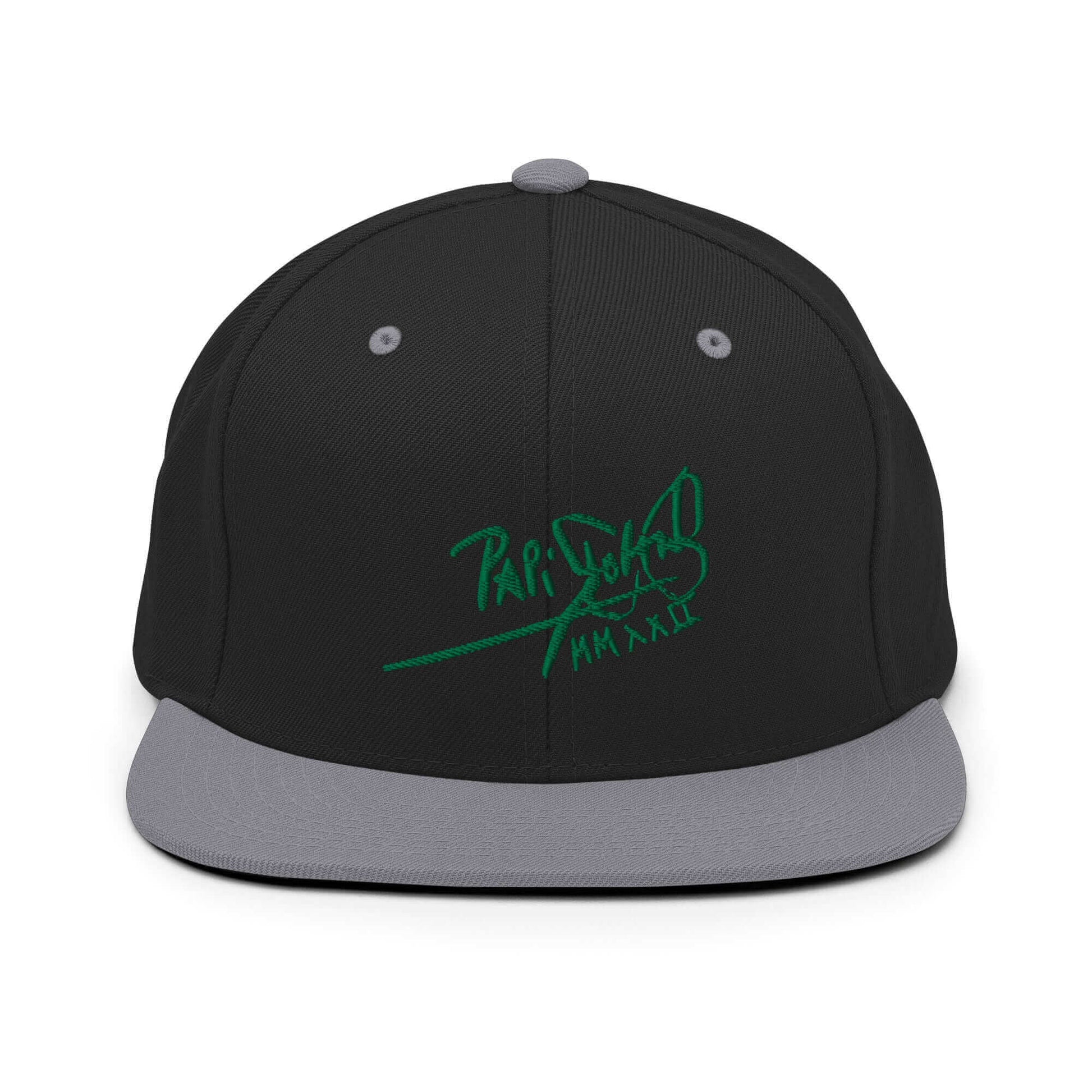 PapiJohn® The Green Signature Classic Snapback in black and silver split layout highlighting the bold green tridimensional script on the dark structured front | Sala 1 Wearable Art Fashion