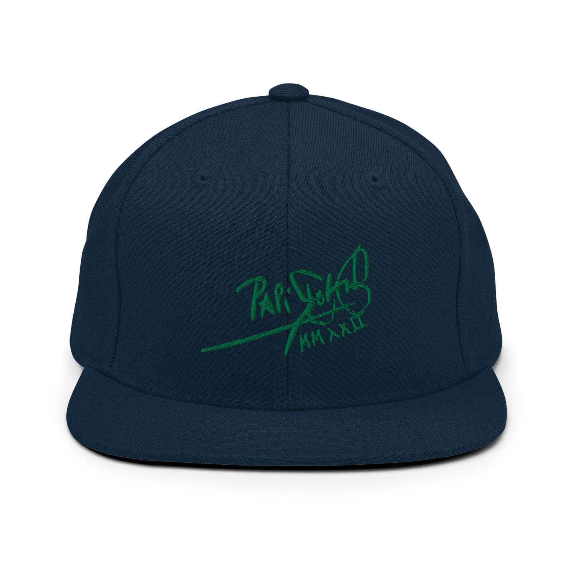 PapiJohn® The Green Signature Classic Snapback in dark navy front view highlighting the vibrant green calligraphic branding text embroidered in dense high-density premium thread | Sala 1 Wearable Art Fashion