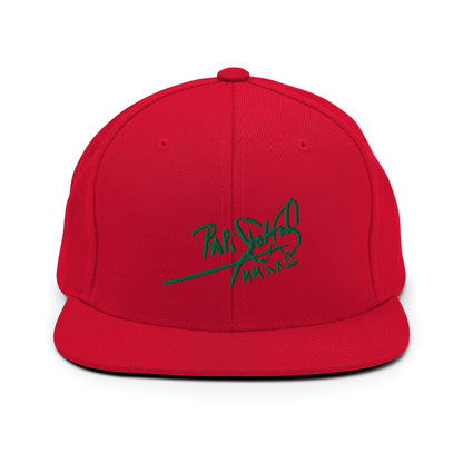 PapiJohn® The Green Signature Classic Snapback in vibrant crimson red front view accentuating the striking contrast of the bright green high-relief embroidered text | Sala 1 Wearable Art Fashion